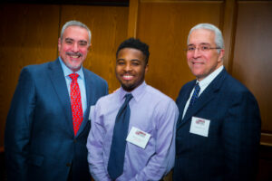Robert Macri '78 and Stephen Macri '82 with Sedomo Agosa '18 at the Scholarship Recognition Dinner