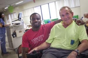 Kofi Boateng '16 and Gracedale Nursing Home resident Jeff Loch