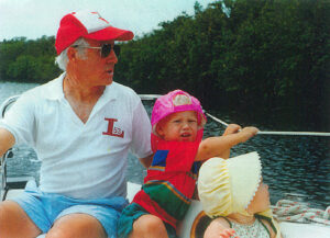 Don Mildrum '53 on the sailboat Nancy Beth with his grandchildren