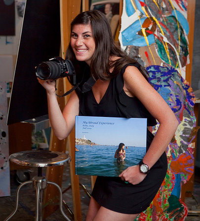 Nina Horowitz '11 as a student, carrying a camera and a photo album