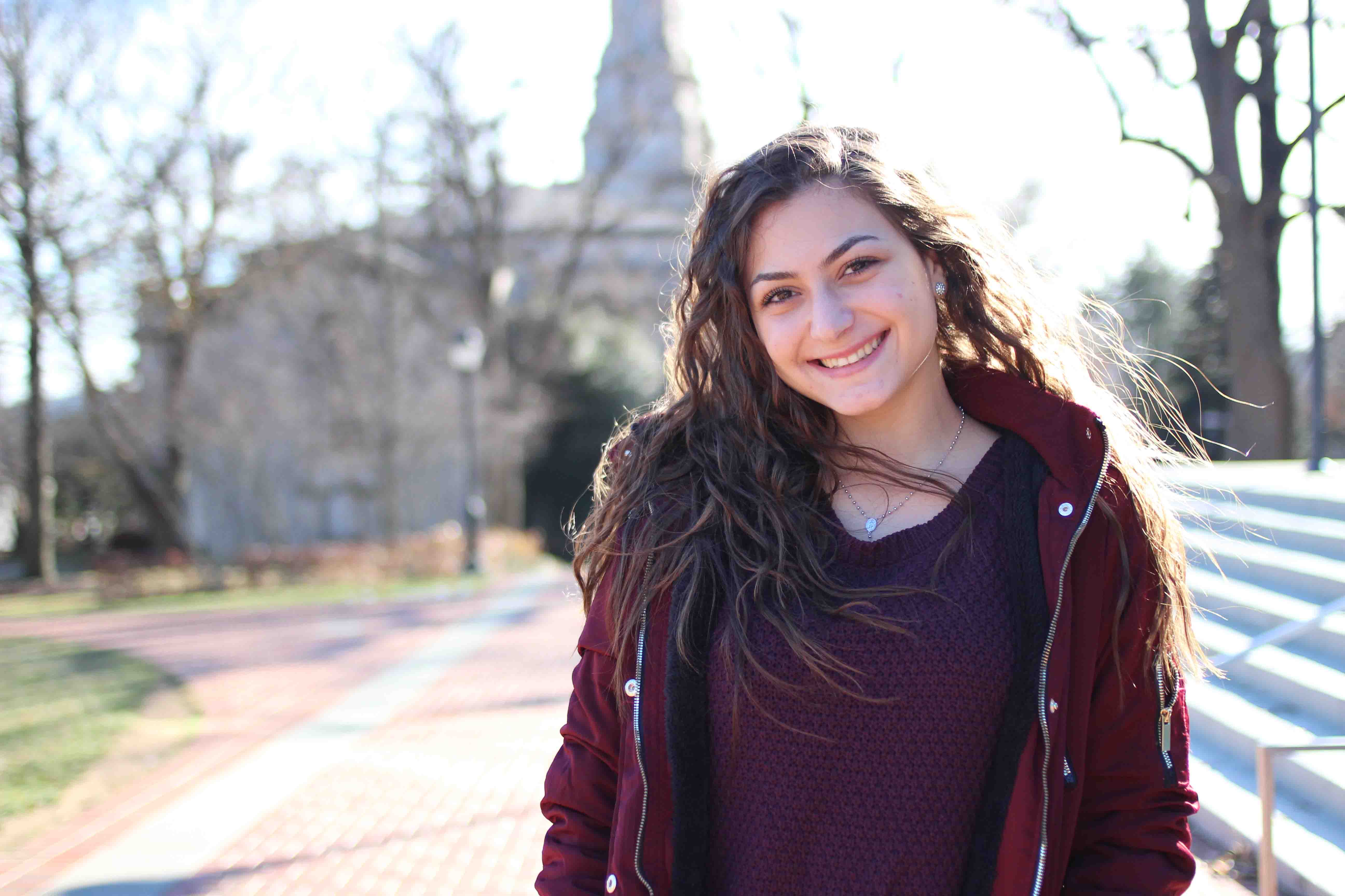 Jessica Ammous poses for a photo in front of Skillman Library.